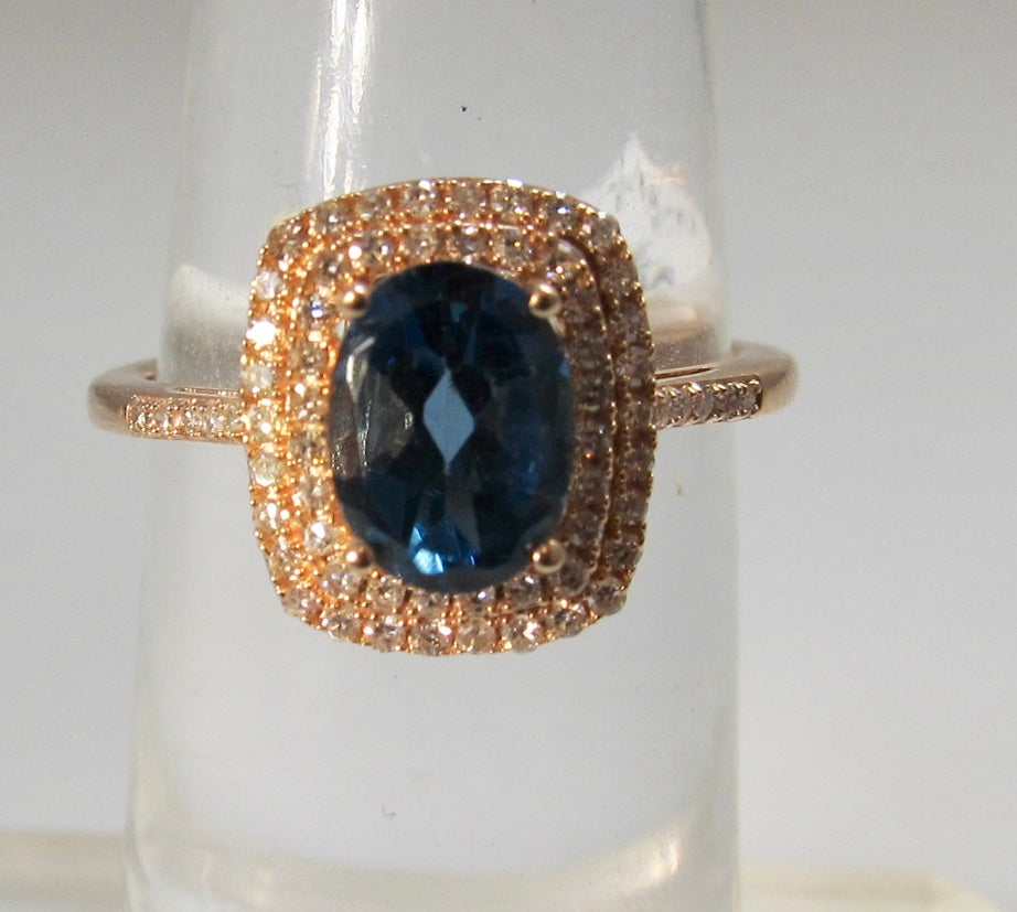 Rose gold blue topaz ring