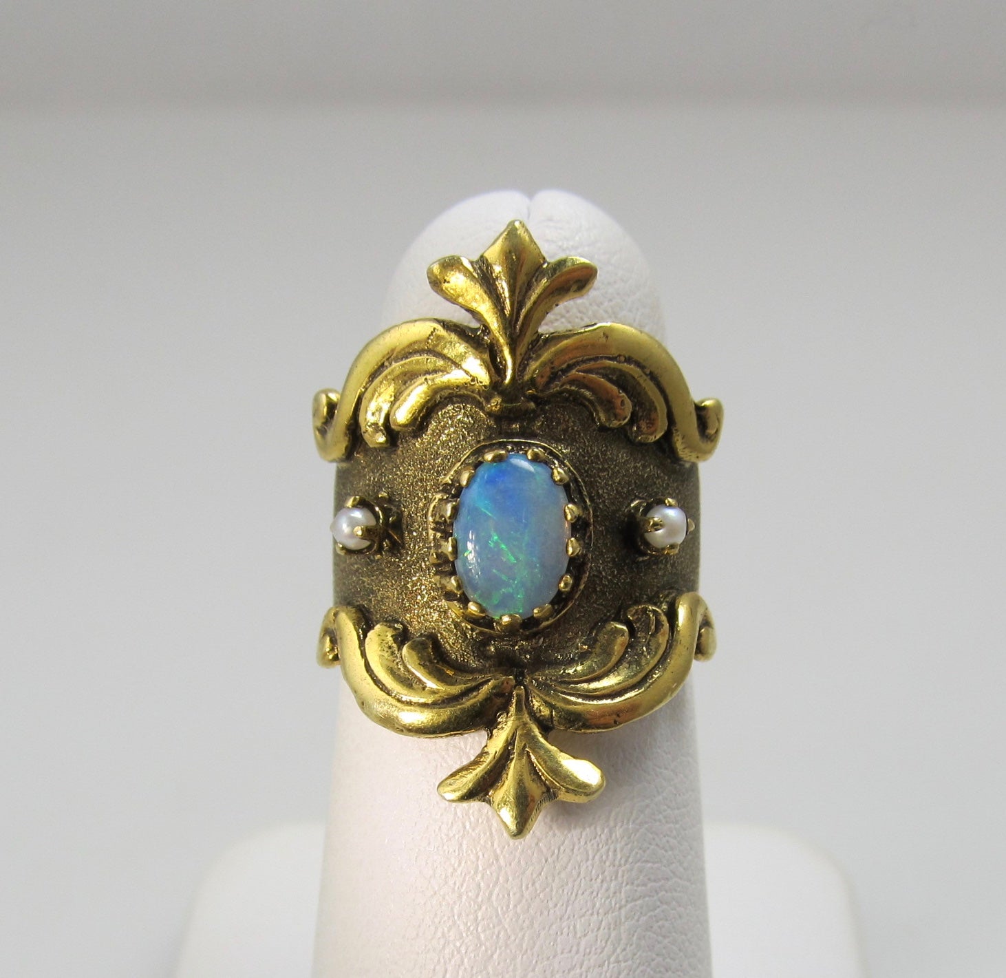 Wide yellow gold cigar band with opal and pearls