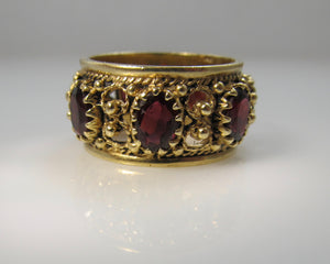 Wide garnet eternity band in 14k yellow gold, size 9 1/2