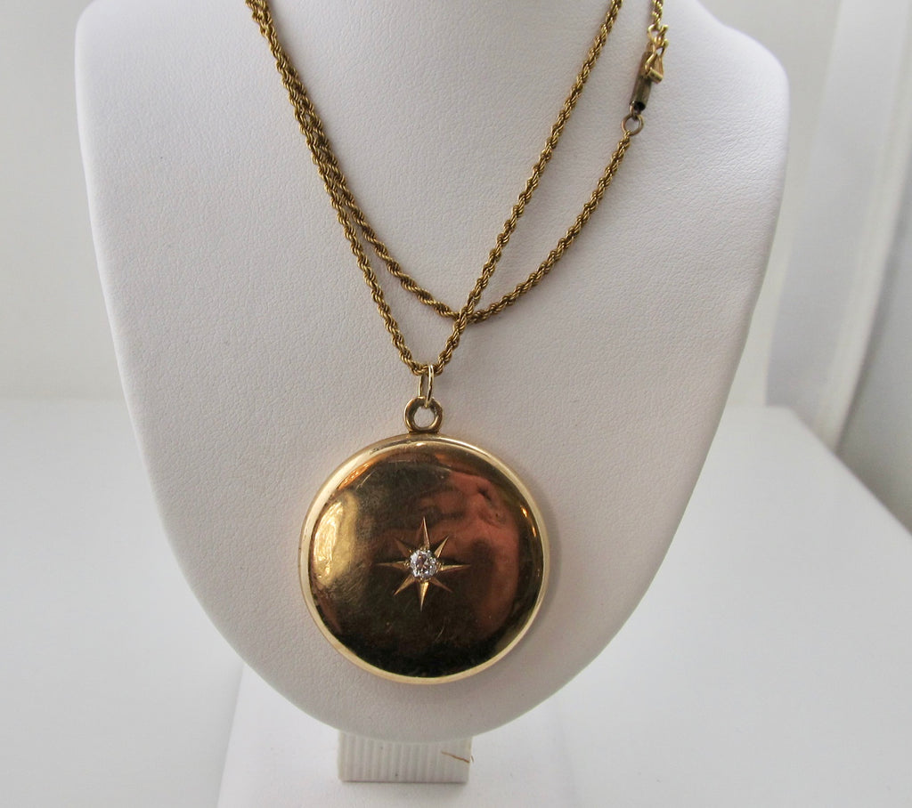 Antique 14k rose gold locket with a star set diamond