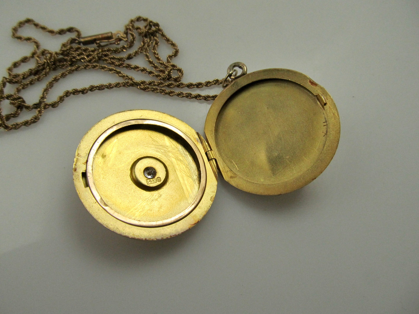 Antique 14k rose gold locket with a star set diamond