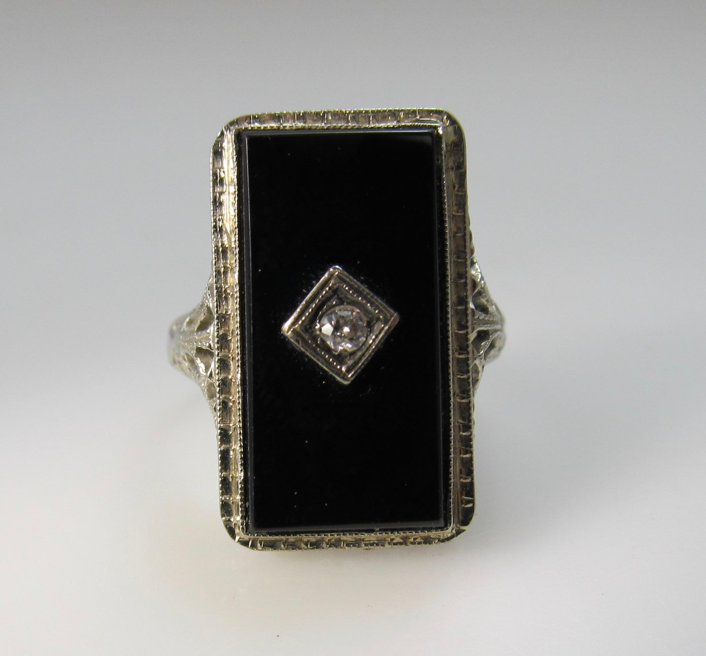 Art Deco onyx and diamond ring, 14k white gold filigree