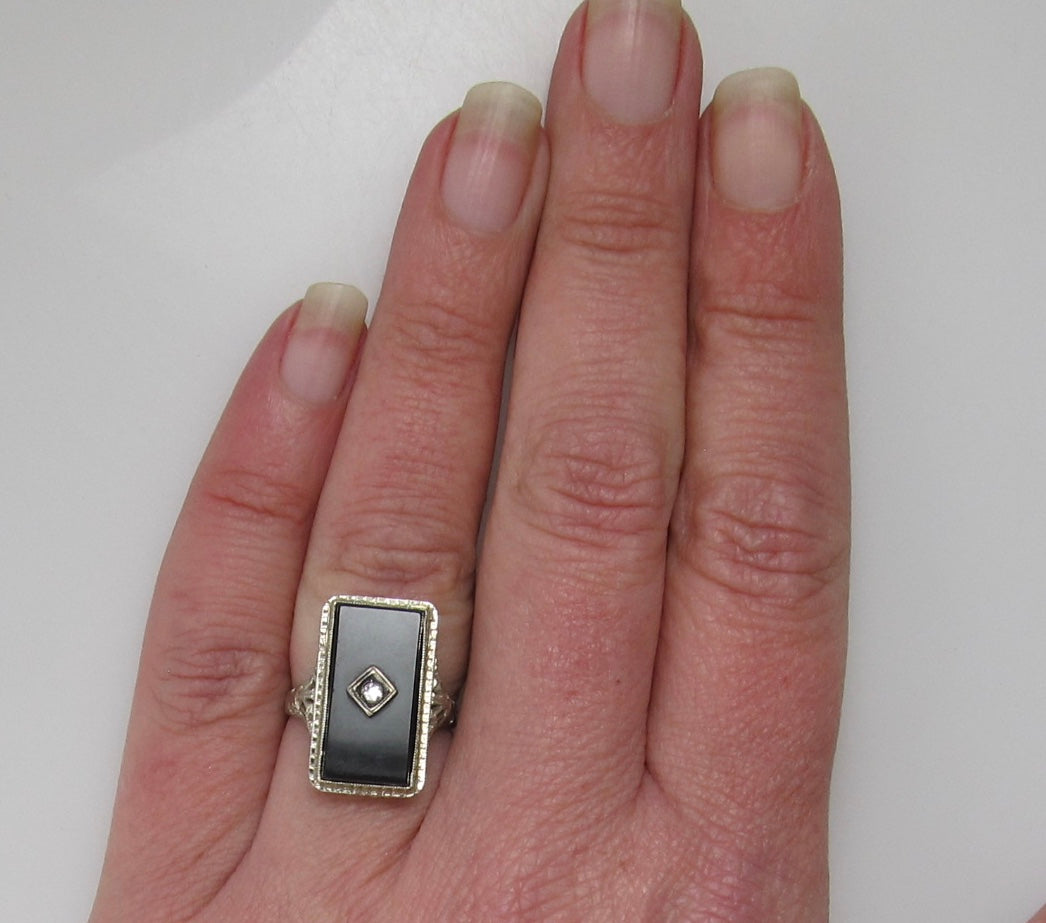 Art Deco onyx and diamond ring, 14k white gold filigree