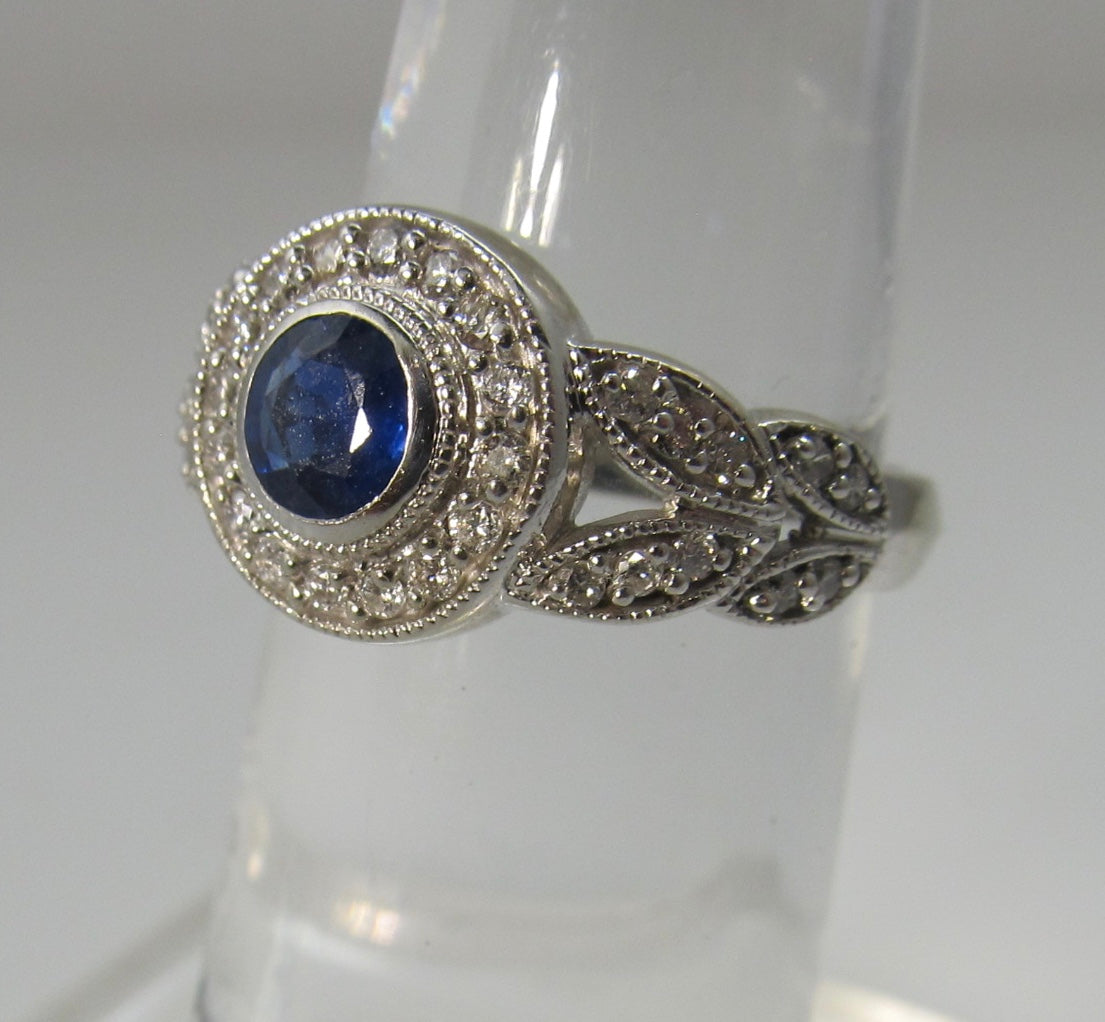 Sapphire and diamond halo ring, 14k white gold