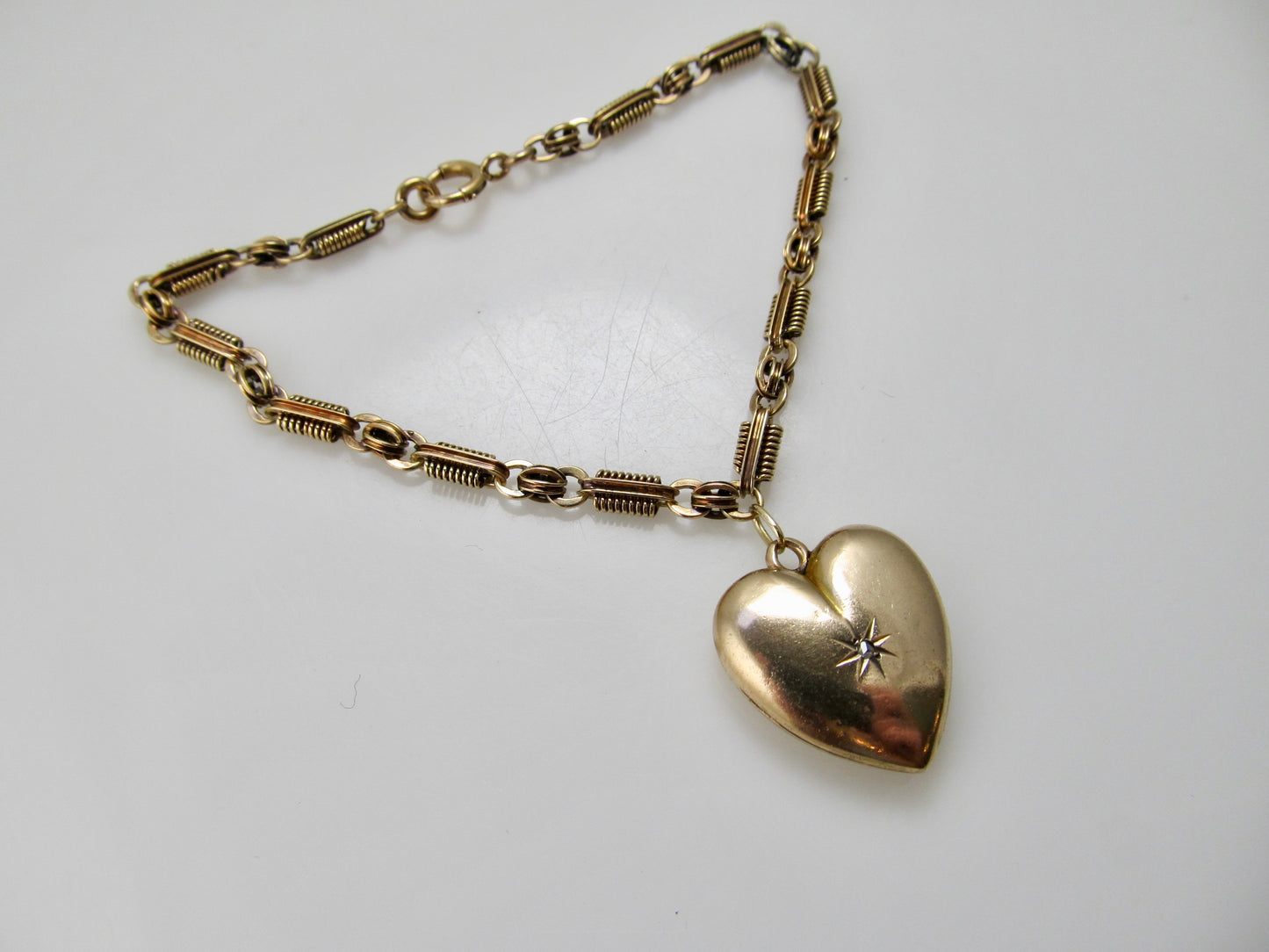 Antique heart locket charm bracelet, 14k