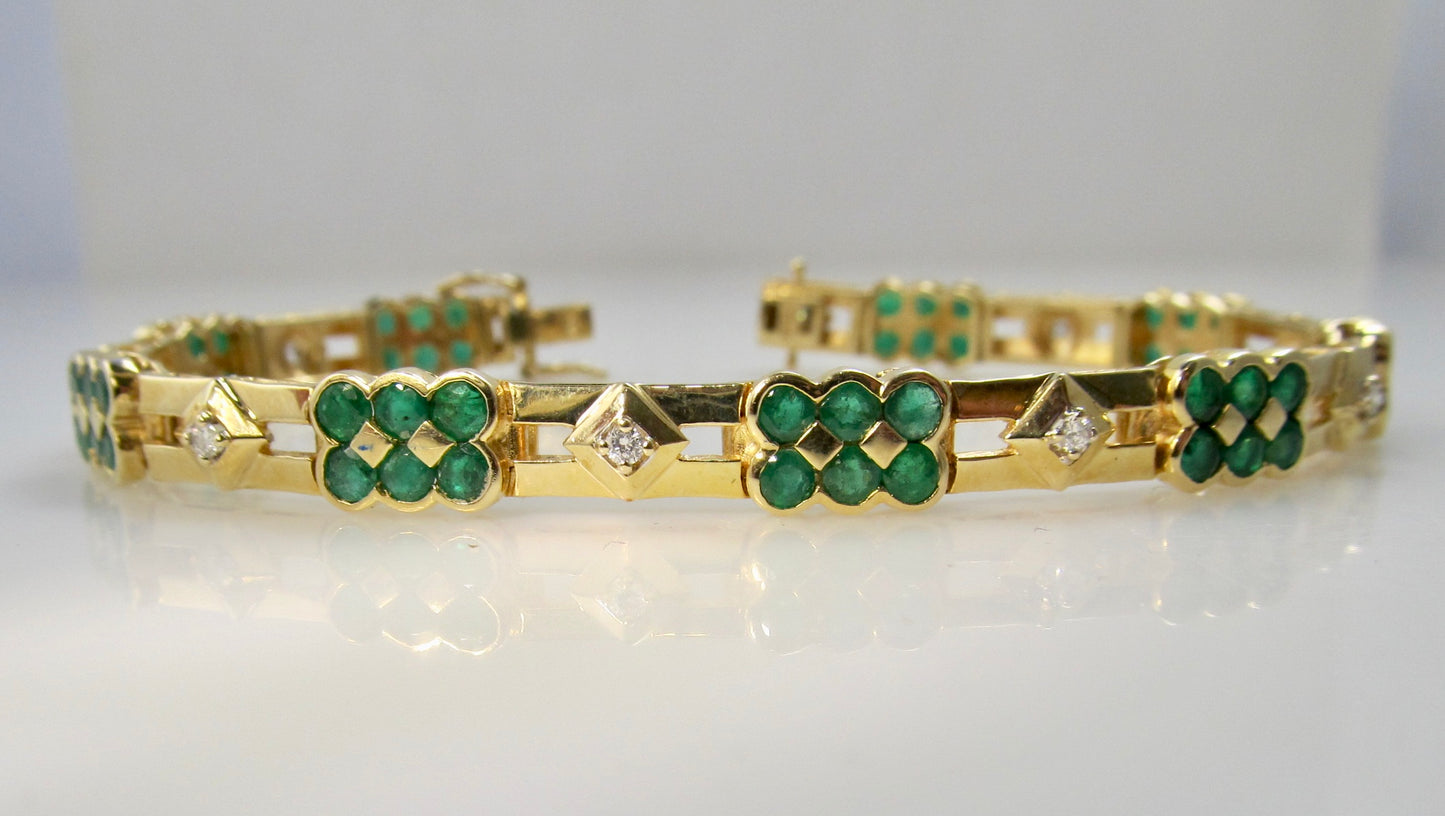 14k yellow gold line bracelet with emeralds and diamonds
