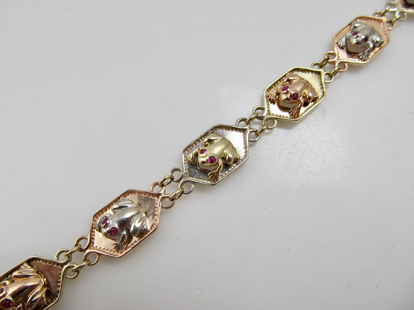 14k white, rose and yellow gold frog bracelet with ruby
