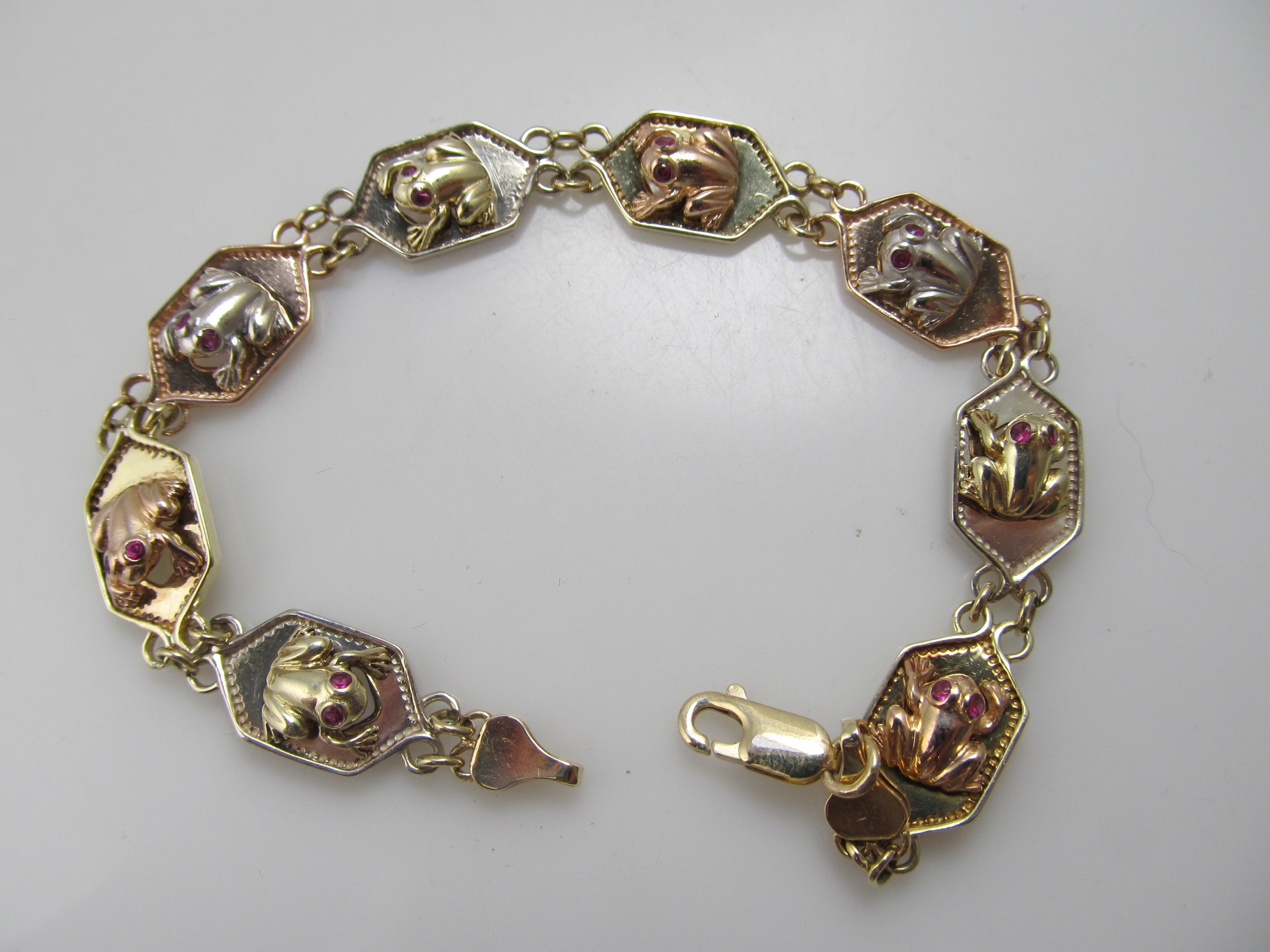 14k white, rose and yellow gold frog bracelet with ruby