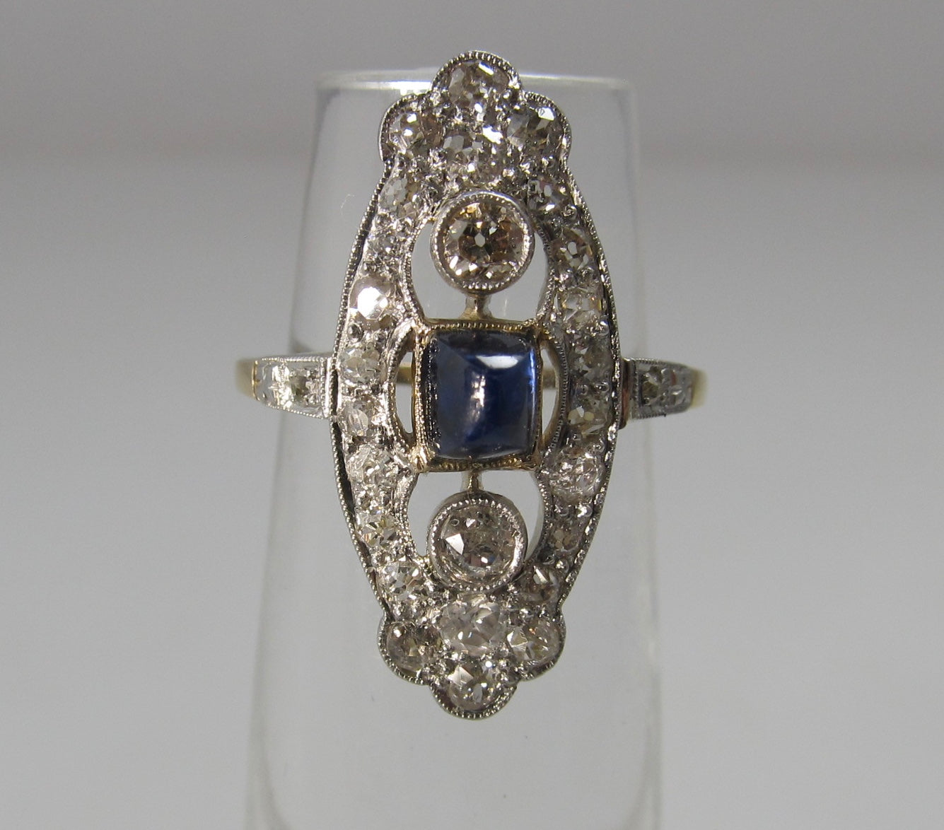 Navette shaped sapphire and diamond ring, 14k and platinum