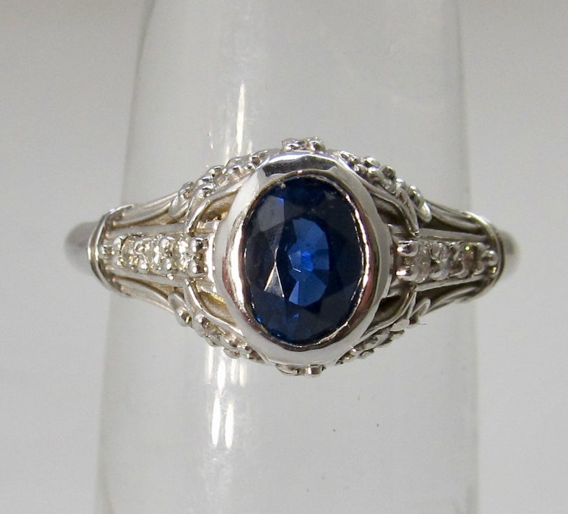 Filigree ring with a sapphire and diamonds