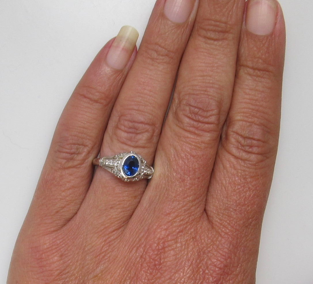 Filigree ring with a sapphire and diamonds