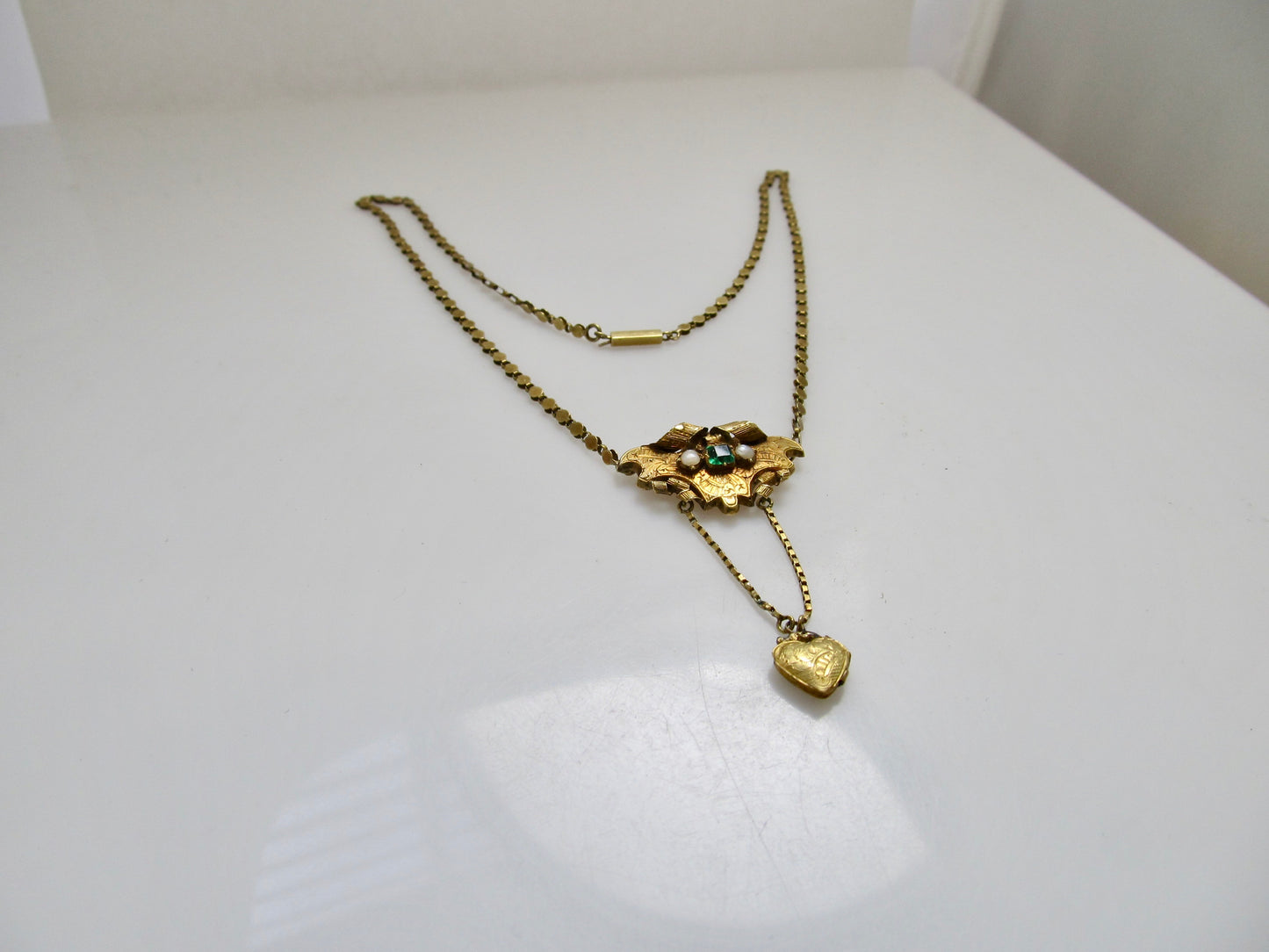 Victorian yellow gold emerald locket necklace