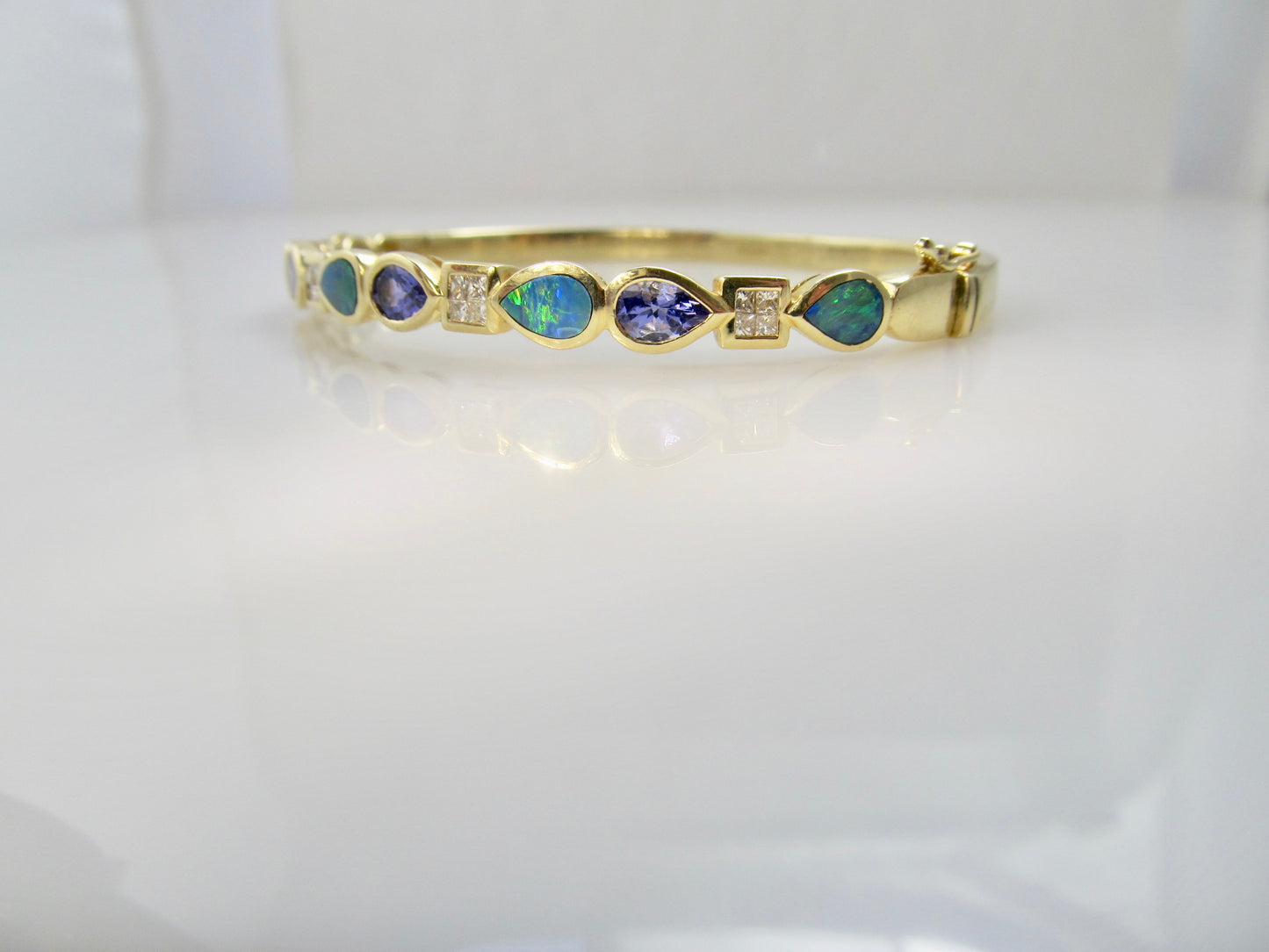 Tanzanite, opal and diamond bangle bracelet