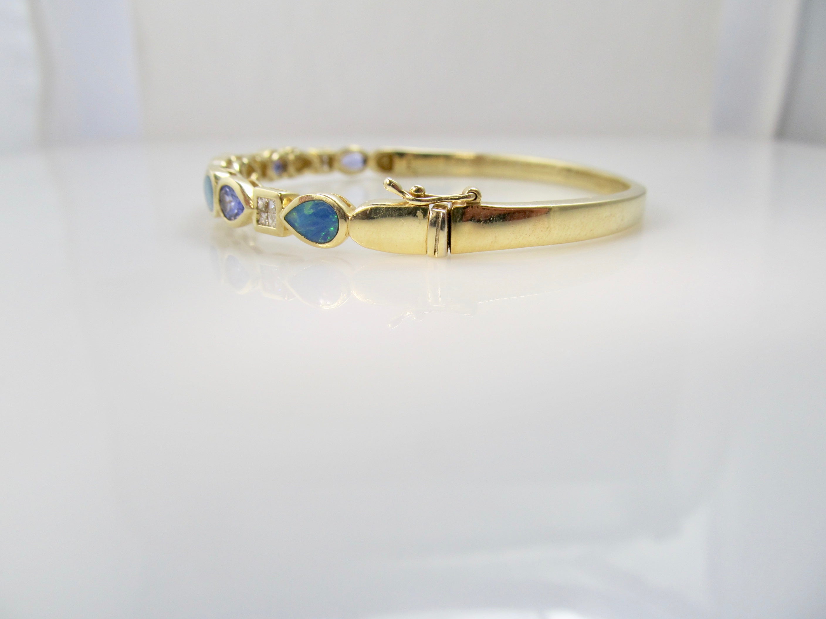 Tanzanite, opal and diamond bangle bracelet