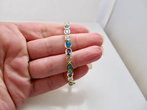 Tanzanite, opal and diamond bangle bracelet