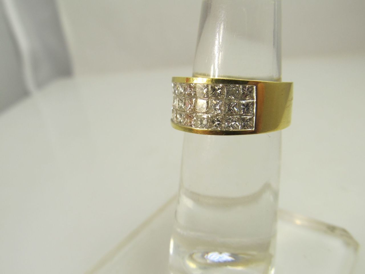 18k yellow gold band with 1.35cts in illusion set princess cut diamonds
