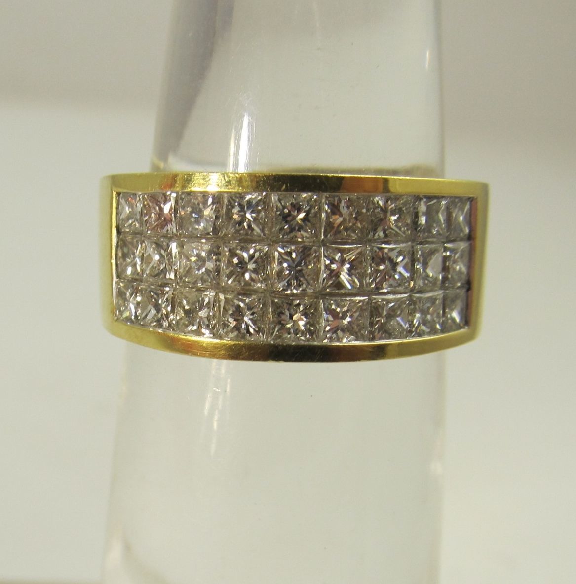 18k yellow gold band with 1.35cts in illusion set princess cut diamonds